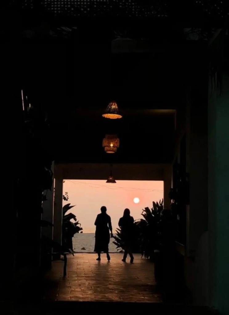 Silhouette at sunset doorway